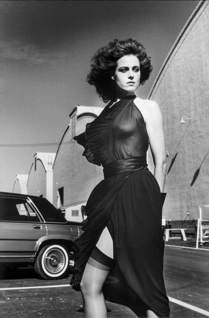Helmut-Newton-1983-Sigourney-Weaver-on-the-Warner-Bros.-Lot-Burbank-674×1024